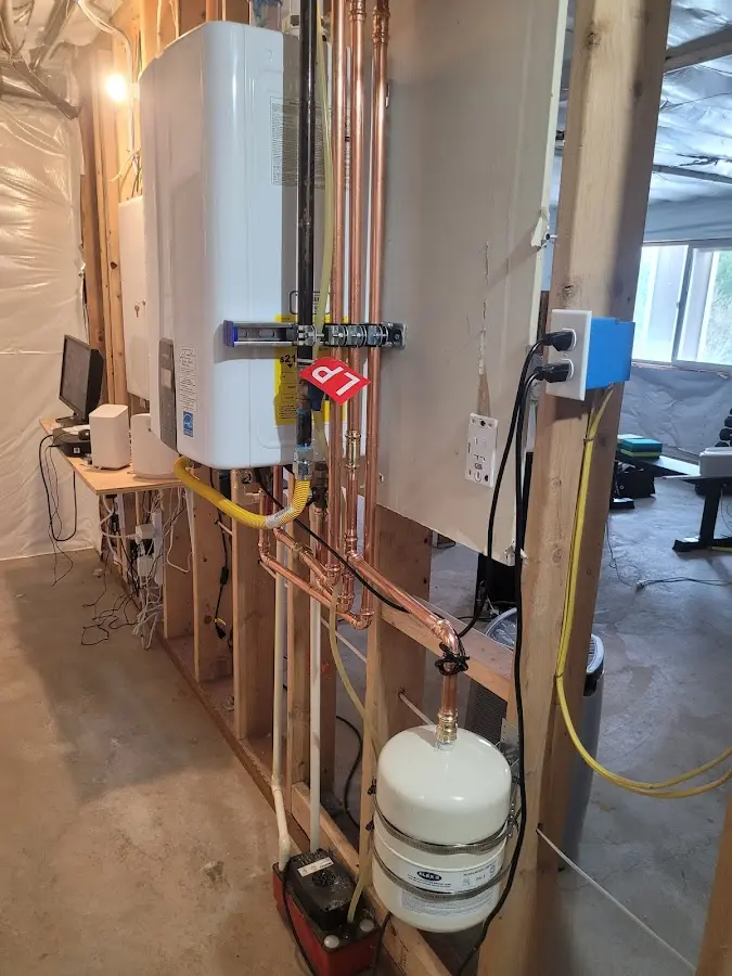 Licensed plumber repairing a kitchen sink in Monona
