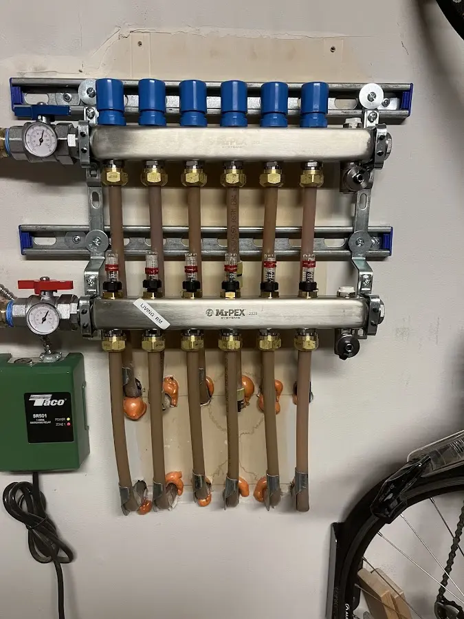 Plumber performing Water Heater Repair at a residential property in Monona